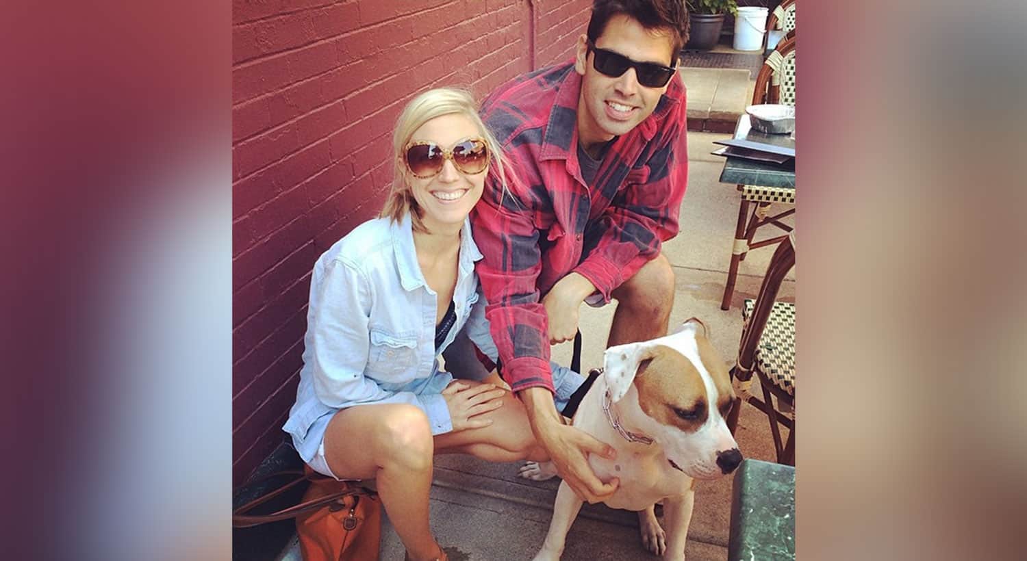 Tamara and her partner crouched at a sidewalk cafe beside Tatanka, their white and tan rescue pit bull.